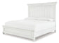Kanwyn King Panel Bed with Mirrored Dresser, Chest and Nightstand