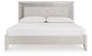 Zyniden King Upholstered Panel Bed with Mirrored Dresser and Nightstand